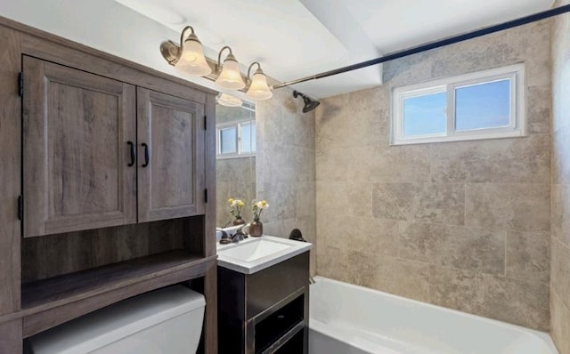 bathroom featuring shower / bath combination, toilet, and vanity