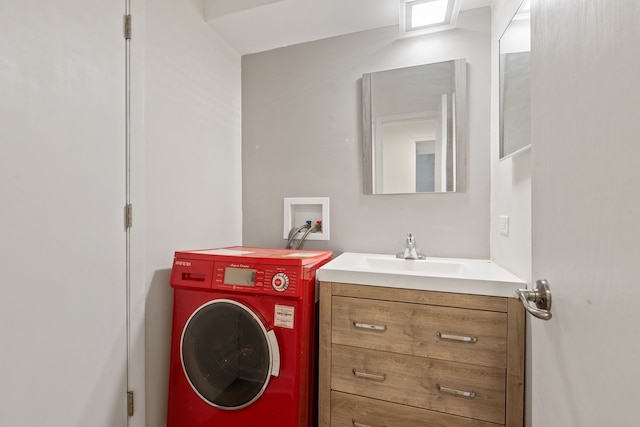 bathroom with washer / dryer and vanity