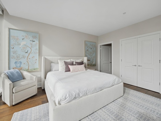 bedroom with a closet and wood finished floors