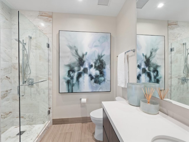 full bathroom with vanity, baseboards, visible vents, a marble finish shower, and toilet