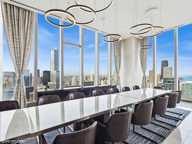 tiled dining area with a city view, floor to ceiling windows, and an inviting chandelier