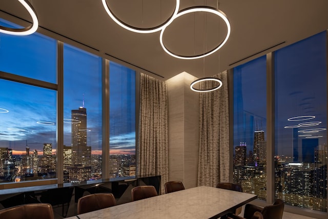 unfurnished dining area featuring a city view and a wall of windows