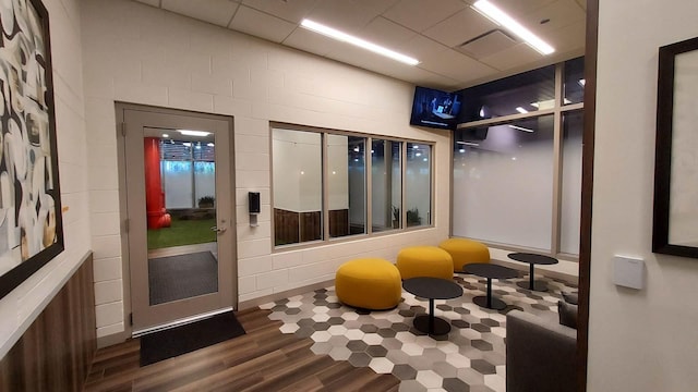 workout room featuring wood finished floors