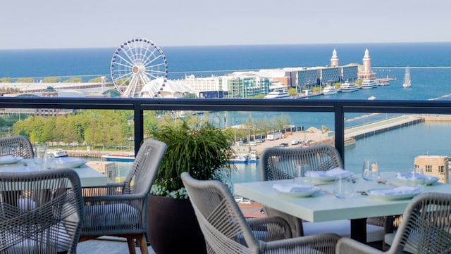 balcony featuring a water view