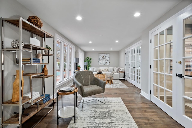 sitting room featuring dark wood-style floors, recessed lighting, french doors, and baseboards