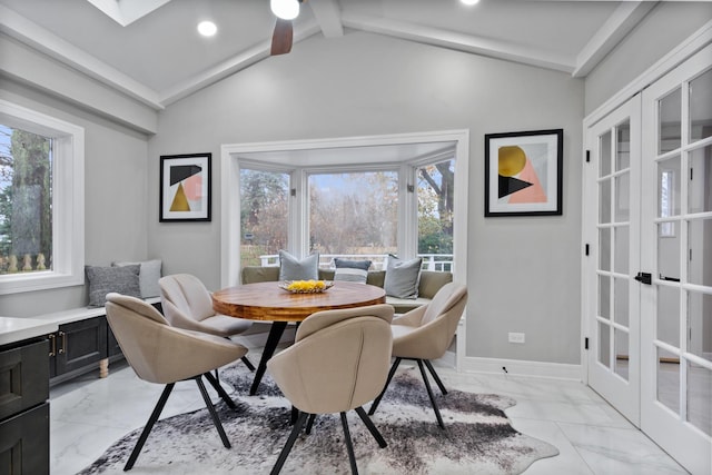 dining area featuring marble finish floor, french doors, recessed lighting, vaulted ceiling with skylight, and baseboards