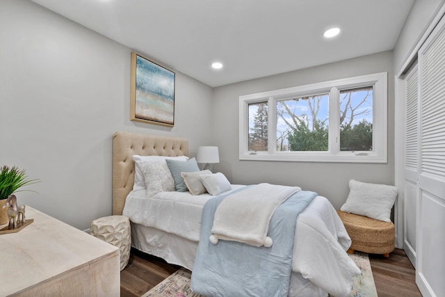 bedroom featuring recessed lighting, a closet, and wood finished floors