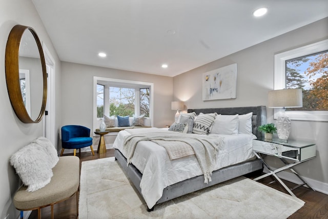 bedroom with recessed lighting, baseboards, and wood finished floors