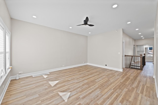 spare room featuring visible vents, baseboards, ceiling fan, light wood-style floors, and recessed lighting