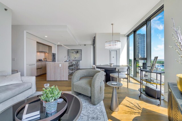 211 N Harbor Dr Unit 1502, Chicago, IL 60601 - living area with a notable chandelier, a wall of windows, wood finished floors, and recessed lighting