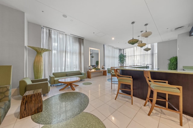 interior space featuring visible vents, plenty of natural light, and light tile patterned floors