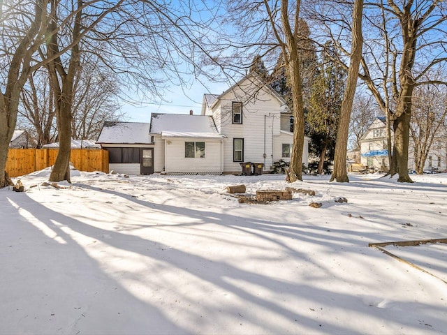 view of front of property featuring fence