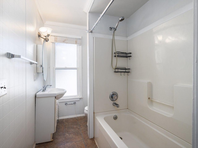 full bath featuring toilet,  shower combination, tile walls, and vanity