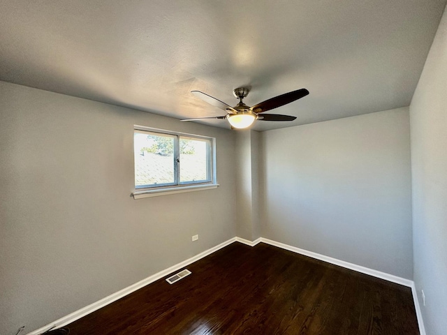 9310 S Eggleston Ave, Chicago, IL 60620 - spare room featuring dark wood finished floors, baseboards, ceiling fan, and visible vents