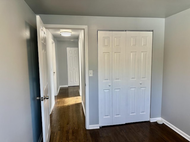 9310 S Eggleston Ave, Chicago, IL 60620 - unfurnished bedroom featuring baseboards, a closet, and dark wood-style flooring