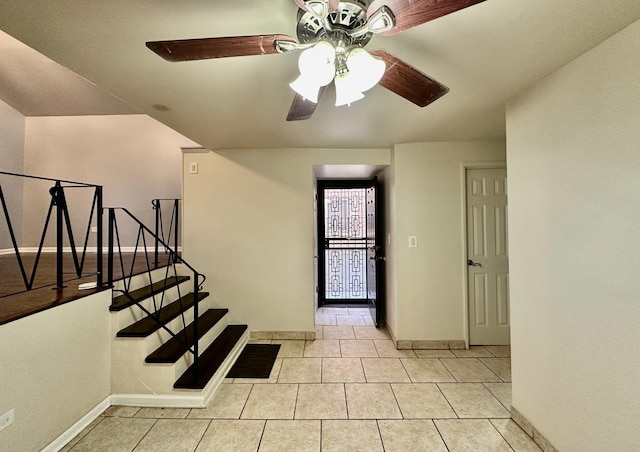 9310 S Eggleston Ave, Chicago, IL 60620 - foyer with light tile patterned floors, baseboards, stairway, and ceiling fan