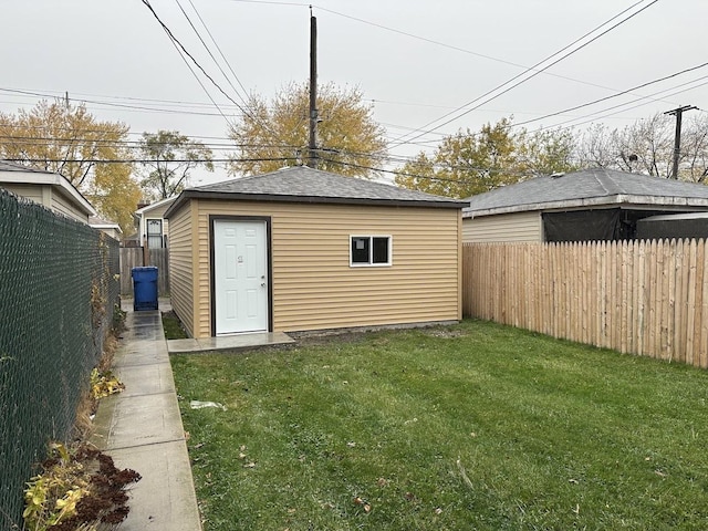 9310 S Eggleston Ave, Chicago, IL 60620 - view of outdoor structure featuring an outbuilding and a fenced backyard