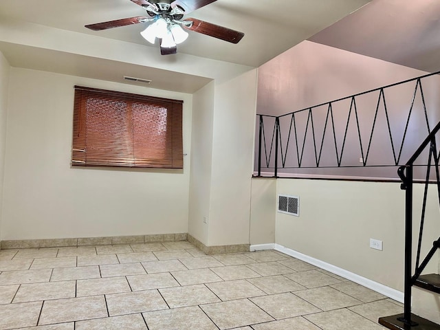9310 S Eggleston Ave, Chicago, IL 60620 - tiled empty room featuring baseboards, a ceiling fan, and visible vents