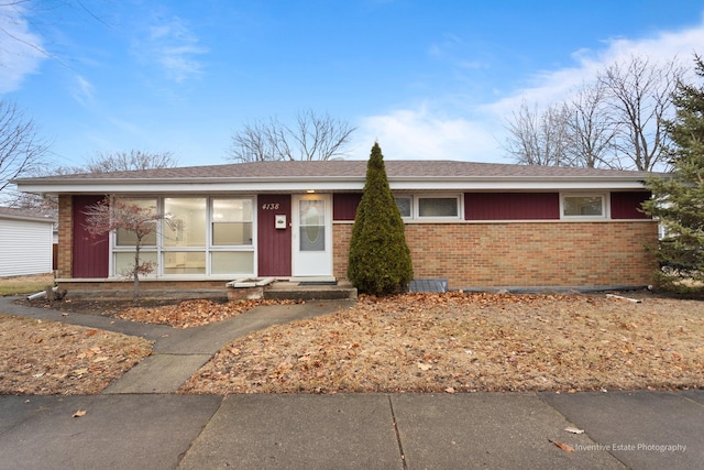 single story home with brick siding