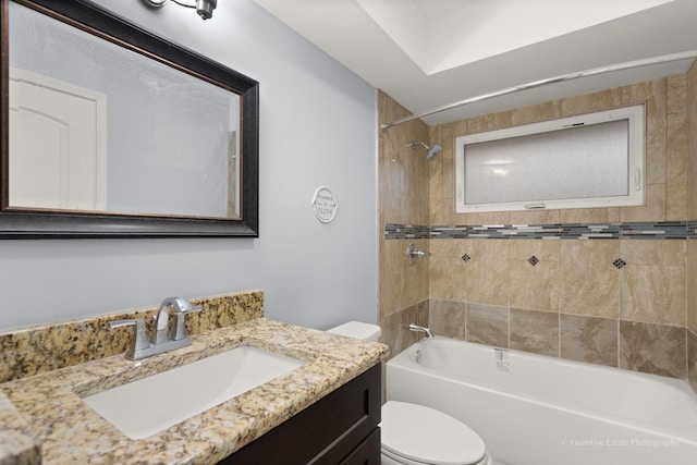 full bathroom featuring toilet,  shower combination, and vanity