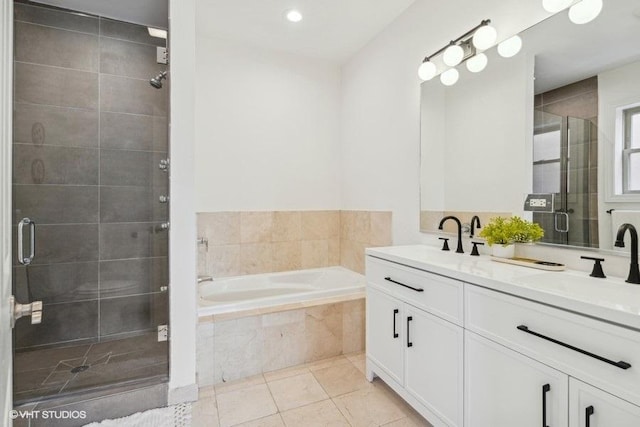 full bathroom with double vanity, a stall shower, a sink, a bath, and tile patterned floors