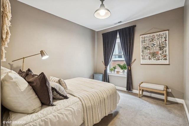 bedroom featuring carpet, visible vents, and baseboards