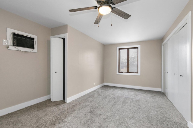 unfurnished bedroom featuring carpet, baseboards, and a closet