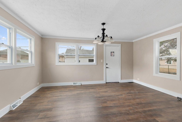 unfurnished dining area with a textured ceiling, visible vents, a chandelier, and dark wood-type flooring