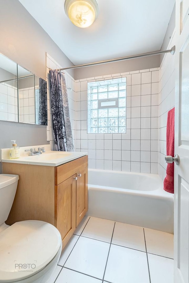 full bathroom with tile patterned flooring, shower / bath combo with shower curtain, and vanity