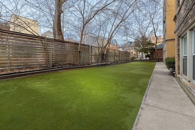 view of yard with a fenced backyard