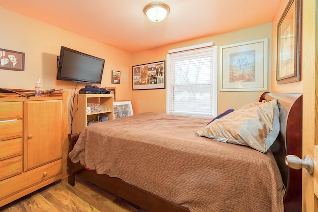 bedroom featuring wood finished floors