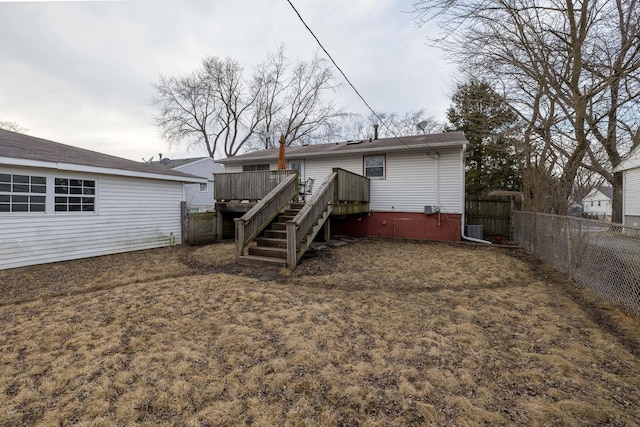 back of property featuring central AC unit, stairway, a fenced backyard, and a wooden deck