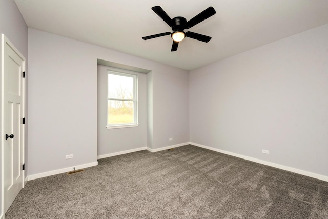 unfurnished room with carpet floors, baseboards, and a ceiling fan