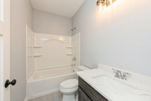 full bathroom featuring toilet, tub / shower combination, and vanity