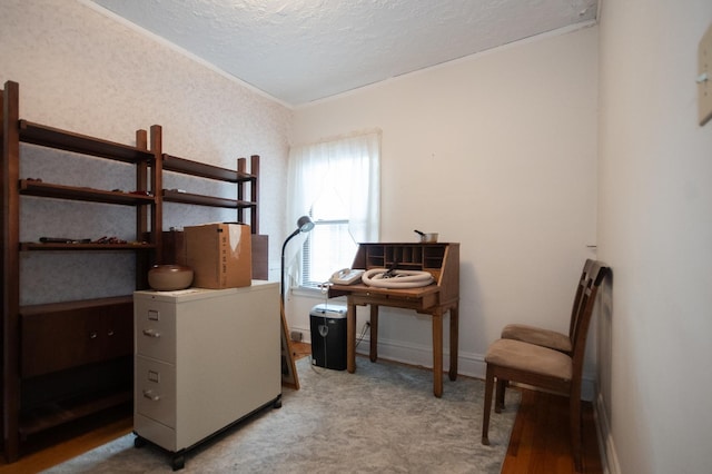 bedroom with ornamental molding, carpet, a textured ceiling, and baseboards