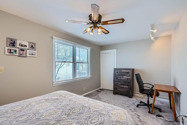 bedroom featuring carpet, baseboards, and a ceiling fan