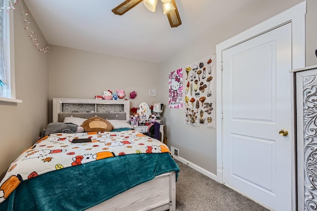 bedroom with carpet flooring, ceiling fan, and baseboards