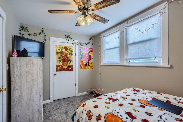 carpeted bedroom with baseboards and a ceiling fan