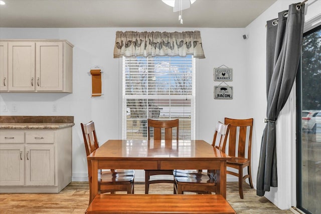 dining area featuring light wood-type flooring