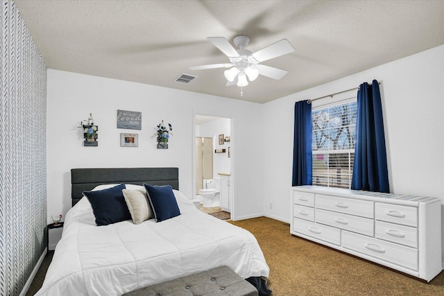 carpeted bedroom with a ceiling fan, visible vents, a textured ceiling, and baseboards