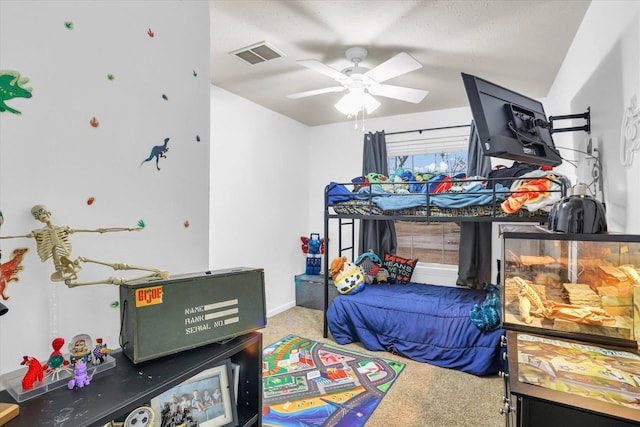 bedroom featuring carpet floors, visible vents, and a ceiling fan