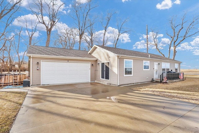 single story home featuring driveway and an attached garage