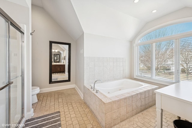 full bathroom featuring a stall shower, toilet, tile patterned flooring, vaulted ceiling, and a bath