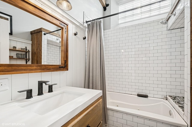 full bathroom featuring a combined bath / shower with jetted tub and vanity