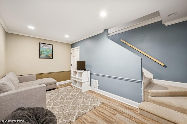 living room with baseboards, stairway, wood finished floors, and ornamental molding