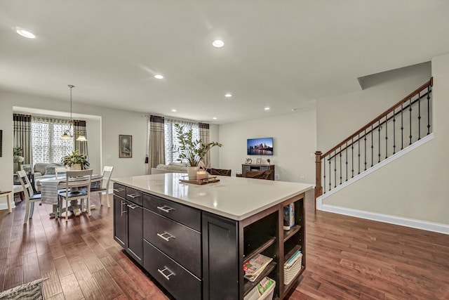 kitchen with a wealth of natural light, open floor plan, and dark wood-type flooring