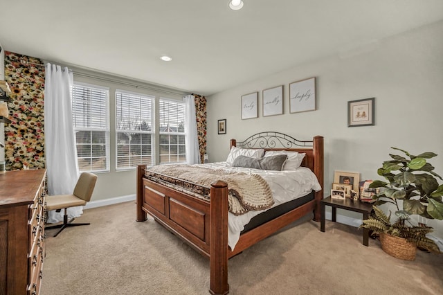 bedroom with light carpet, recessed lighting, and baseboards