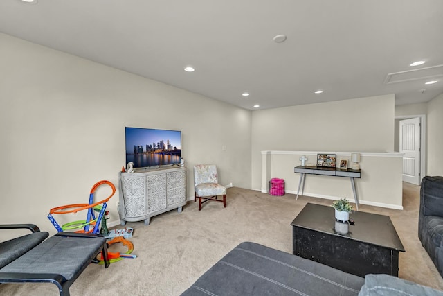 carpeted living room featuring baseboards and recessed lighting