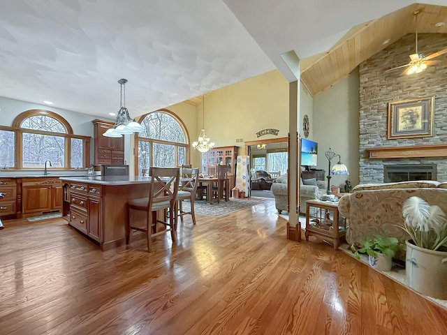 11307 Timber Lane Rd, Lena, IL 61048 - kitchen featuring open floor plan, a ceiling fan, light wood-type flooring, and high vaulted ceiling