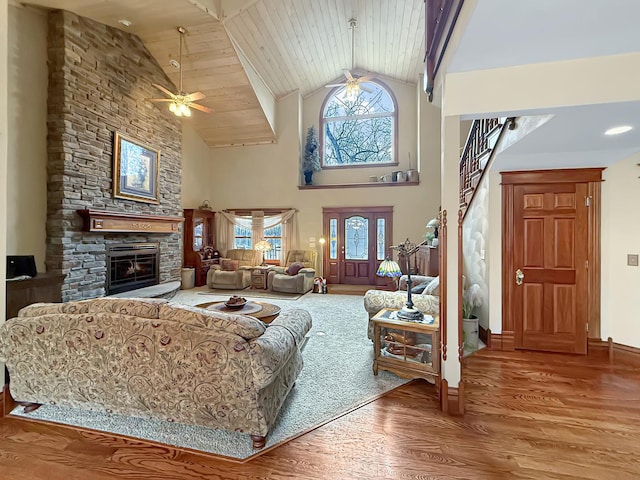 11307 Timber Lane Rd, Lena, IL 61048 - living room with plenty of natural light, wood finished floors, a fireplace, ceiling fan, and high vaulted ceiling